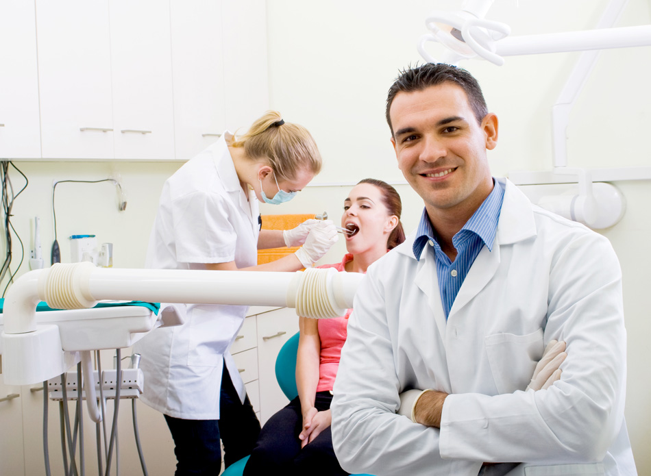 Young dentist in dental practice